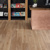 Pale Limed Oak lvp floors in a bookstore; available to install as gluedown or rigid core flooring
