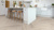 Ashland LLP95 lvt floors in a herringbone pattern in a white kitchen